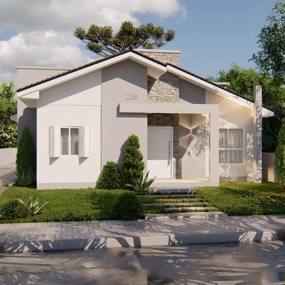 Single-story white and gray house with a gabled roof, porch, lawn, and stone walkway.